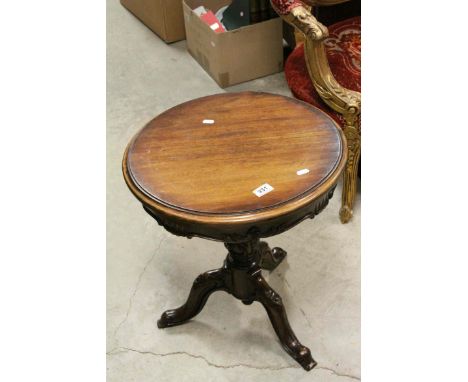 Circular Coffee / Lamp Table raised on Foliate Carved Column Support with Three Splay Legs