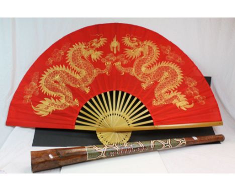 Wooden Didgeridoo with painted decoration and a large Oriental Fan