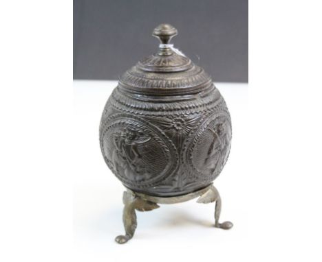 Ornately carved 19th Century Coconut Tea caddy &amp; lid with Brass tripod feet and lid finial