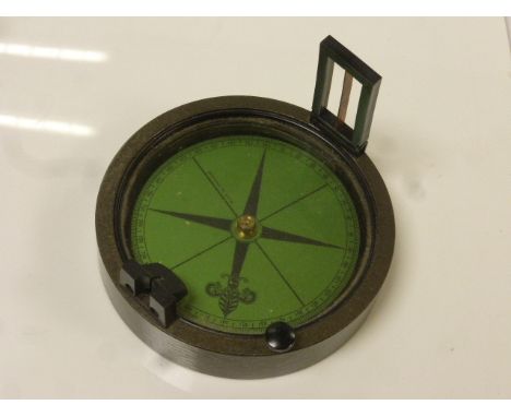 Prismatic compass with green dial, diameter approximately 10cm, boxed 