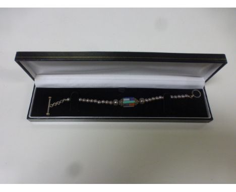 Silver bead bracelet, the central oblong bead set with various hardstone cabochons to include lapis lazuli, carnelian, amethy