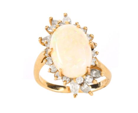 Vintage Approx. 5.0 Carat Oval Cabochon Opal, 1.25 Carat Diamond and 14 Karat Yellow Gold Ring. Opal with good play of multi 