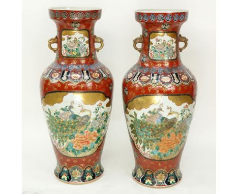 Pair of Palace Size 20th Century Chinese Enamel Painted Porcelain Urns. Baluster form with mock figural handles, several scen