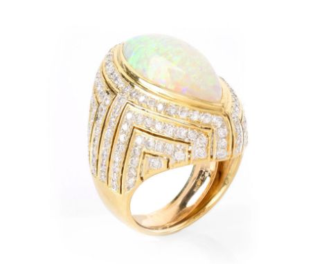 Vintage Approx. 12.0 Carat Marquise Cabochon Opal, 3.0 Carat Diamond and 18 Karat Yellow Gold Ring. Opal with good play of mu