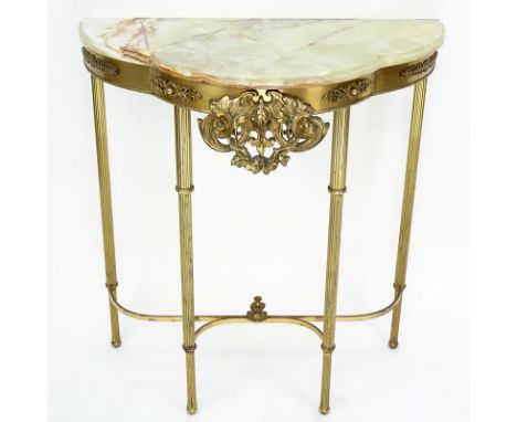 Neoclassical Style Gilt Metal Half Moon Console Table with Onyx Top. Floral decor along the apron with open work center medal