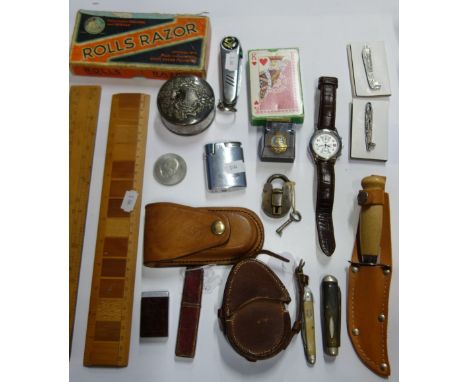 A WORLD WAR I COMPASS in leather case, dated 1916, military badges and sundries