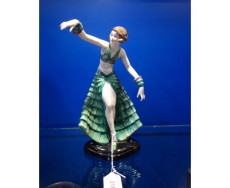 A 1930S CERAMIC STUDY OF A DANCER in a green dress, 25.5cm high