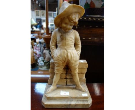 AN EARLY 20TH CENTURY ALABASTER FIGURE of a boy smoking a pipe