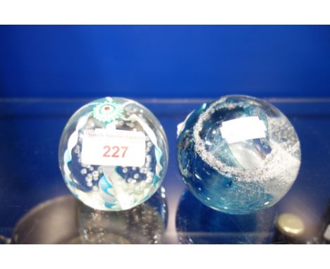 A CAITHNESS GLASS PAPERWEIGHT and another similar