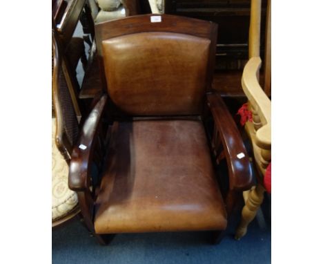 A MAHOGANY FRAMED ART DECO STYLE ARMCHAIR with patinated leather seat and back, 59cm wide