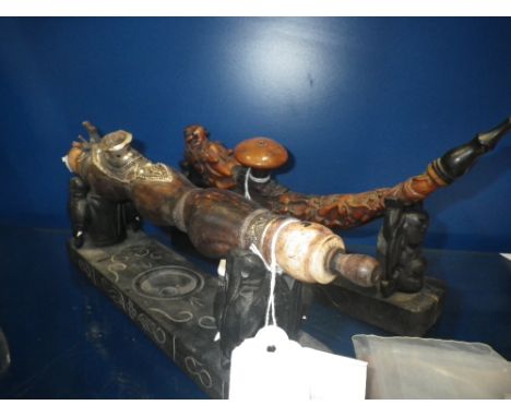 AN OPIUM PIPE in the form of a dragon with stand and another similar (2)