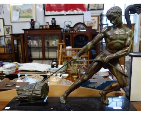 AFTER ALEXANDRE OULINE (act.1918-1940); AN ART DECO PATINATED SCULPTURE, modelled as a young fisherman pulling in his netted 