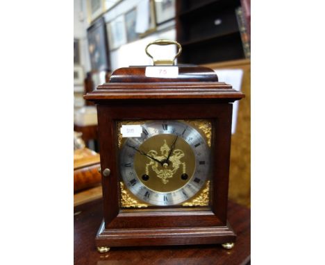 A COMITT OF LONDON MANTEL CLOCK striking on a bell