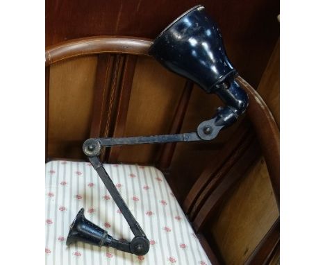 A VINTAGE BLACK PAINTED METAL ADJUSTABLE WORK BENCH LAMP