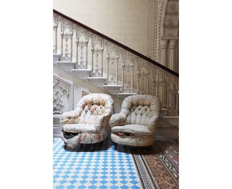 A near pair of button-upholstered spoon-back armchairs,19th century, each on turned legs with brass castors,71cm wide75cm dee