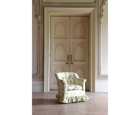 A button-upholstered tub chair by Howard &amp; Sons,early 20th century, raised on square tapering mahogany legs terminating i