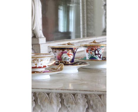 A pair of Crown Derby coffee cups and saucers,late 18th/early 19th century, each decorated with gilded floral sprays,together