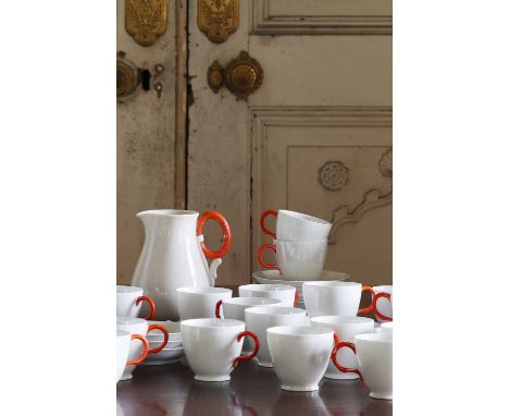 A large quantity of Belleek porcelain,including teacups, saucers and a milk jug,milk jug 10cm wide 12cm deep 14.5cm high (qty