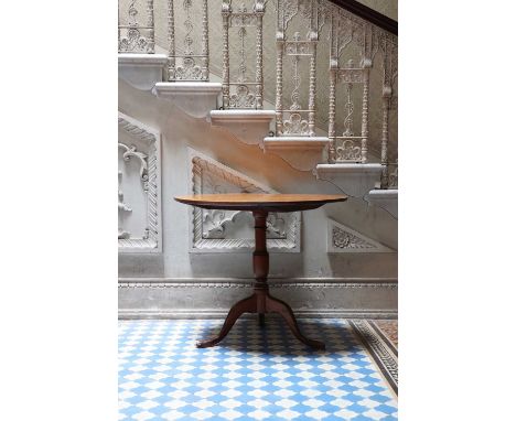 An amboyna veneered oval top pedestal table,19th century, with a folding top on a tripod base,79cm wide89cm deep73cm highCond