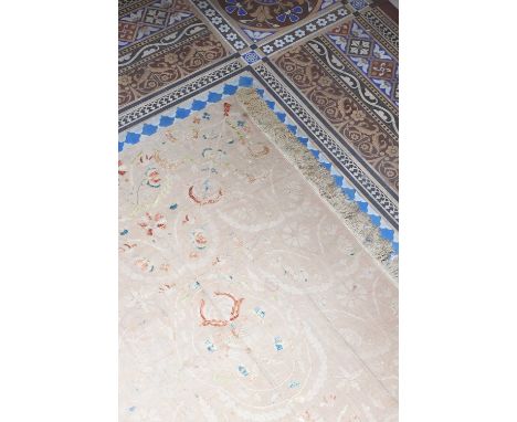 A large embroidered panel,19th century, Turkish Ottoman, worked in coloured silks on a pale brown cotton ground, with tassell
