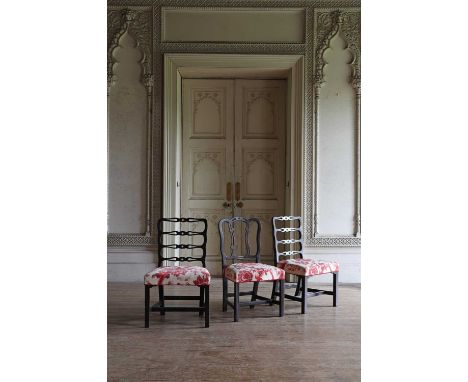 A pair of George III-style mahogany ladder-back dining chairs,19th century, each with an overstuffed seat upholstered in a pr