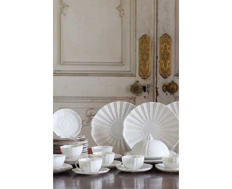 A quantity of Belleek 'Echinus' porcelain teawares, including five teacups and nine saucers, marked Belleek, four shell-shape