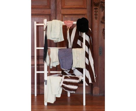 A selection of various costumes and clothing,late 19th century, to include rowing caps and vests, and other sporting attire, 