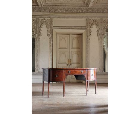 A late Regency mahogany bow-front sideboard,with cellaret drawers flanking a central drawer, ebony line border inlays and bra