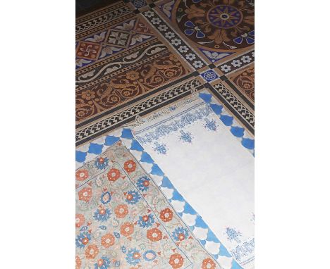 A silk embroidered panel or 'bohça',19th century, Ottoman, worked in blue and red threads on a linen ground, with stylised fo