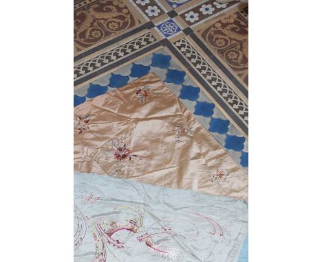 A large silk embroidered panel,early 20th century, Chinese, the pale blue ground embroidered with dragons chasing flaming pea