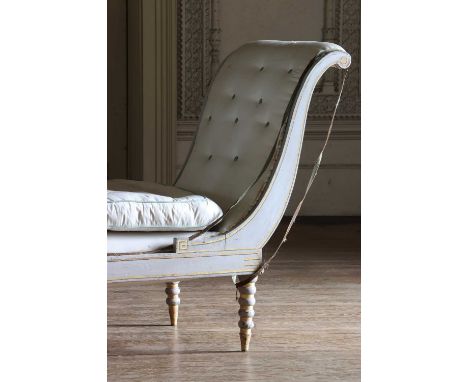 A neoclassical grey painted daybed,early 19th century, the frame and legs highlighted in gilt, with double scroll ends, raise