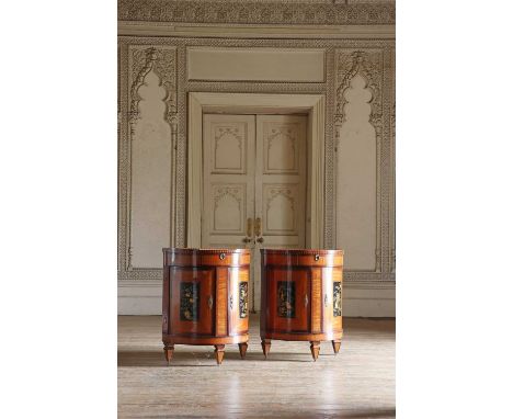 A pair of Dutch satinwood bow-front pier cabinets,c.1820, each with an inlaid galleried top, a blind frieze drawer and lacque