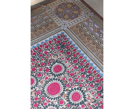 A large Ura-Tube suzani panel,late 19th/early 20th century, Uzbekistan, made up of five panels, worked in polychrome silks on