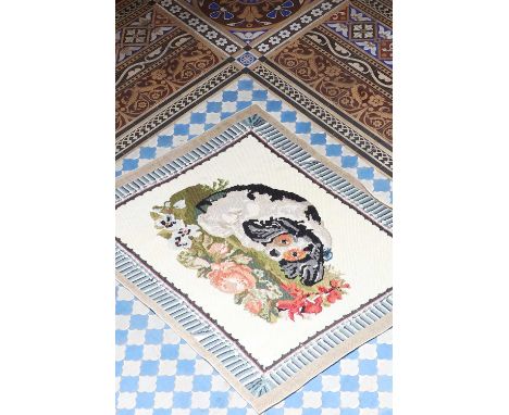 A Victorian woven wool panel,decorated with a resting dog on a floral cushion, to a faux tassel border,13 x 114cm Condition R