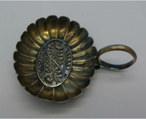A Georgian filigree caddy spoon, repaired