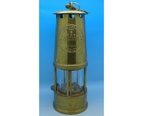 An Eccles Type 6 miner's safety lamp with numbered tag attached, 1479, Manvers