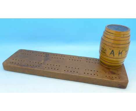 A cribbage board and a barrel shaped string box