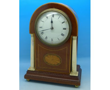 An inlaid arch top mantel clock with two bone pillar supports, the movement marked made in France, 22.5cm, one pillar a/f