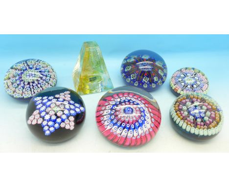 Seven glass paperweights including one millefiori by John Deacons and two Perthshire millefiori, Caithness pyramid and three 