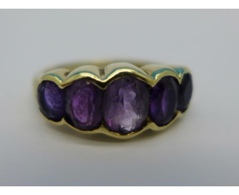 A 9ct gold, five stone amethyst ring, 3.3g, K