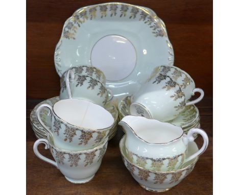 An Adderley china tea service, twenty-one pieces in total, one cup a/f