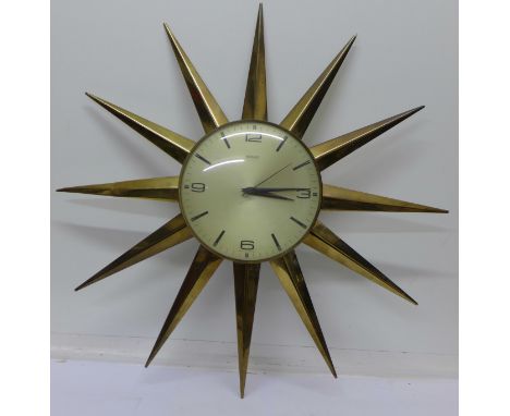 A Metamec starburst wall clock