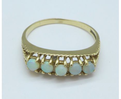 A 9ct gold and five stone opal ring, 2.8g, S