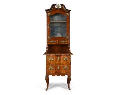 A French gilt-brass mounted walnut vitrine on chest, of Louis XV style, 19th century, the broken swan neck pediment above doo