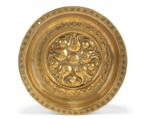 A German brass alms bowl, Nuremberg, first half 16th century, with floral motifs to the well and punched fleur-de-lys to the 