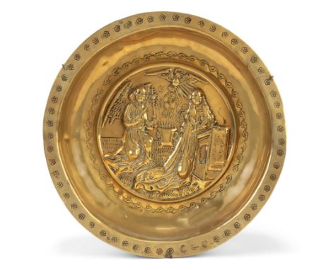 A German brass alms bowl, Nuremberg, first half 16th century, with a depiction of the Annunciation to the well and punched fl