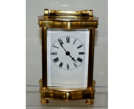 Late 19th / Early 20th century brass carriage clock with serpentine front