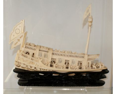 19th Century Chinese canton circa 1880 Carved Ivory tusk in the form of a Junk boat intricate detail and on hardwood stand, 2