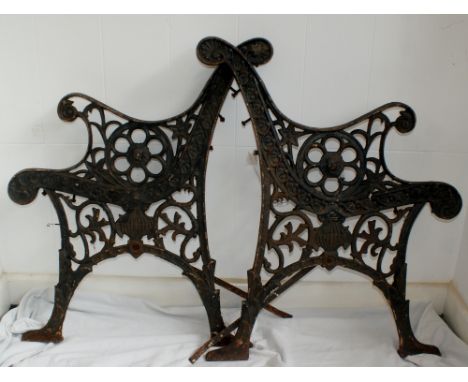 Stunning pair of early cast iron bench ends with lions head decoration