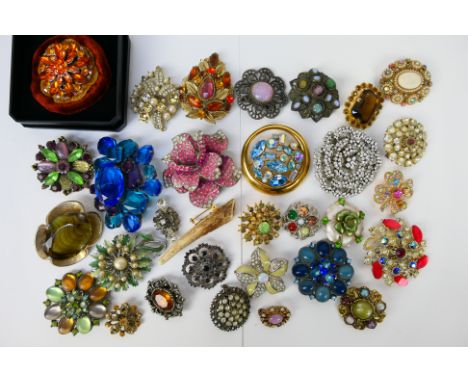 A collection of vintage brooches to include stone set examples, enamelled and other. [W]